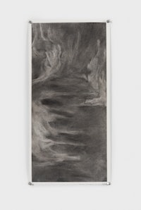 a black and white drawing hanging on a wall